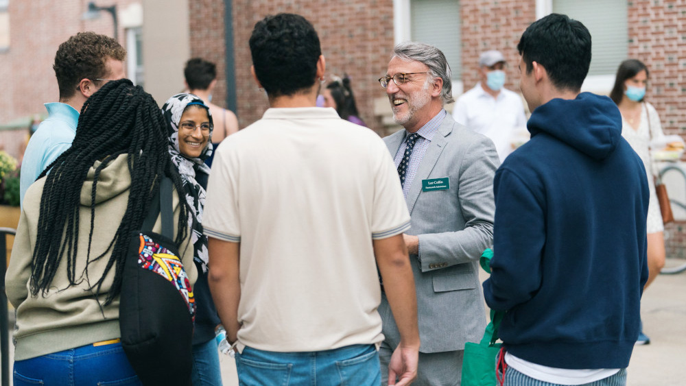 Lee Coffin speaking with students on move-in day