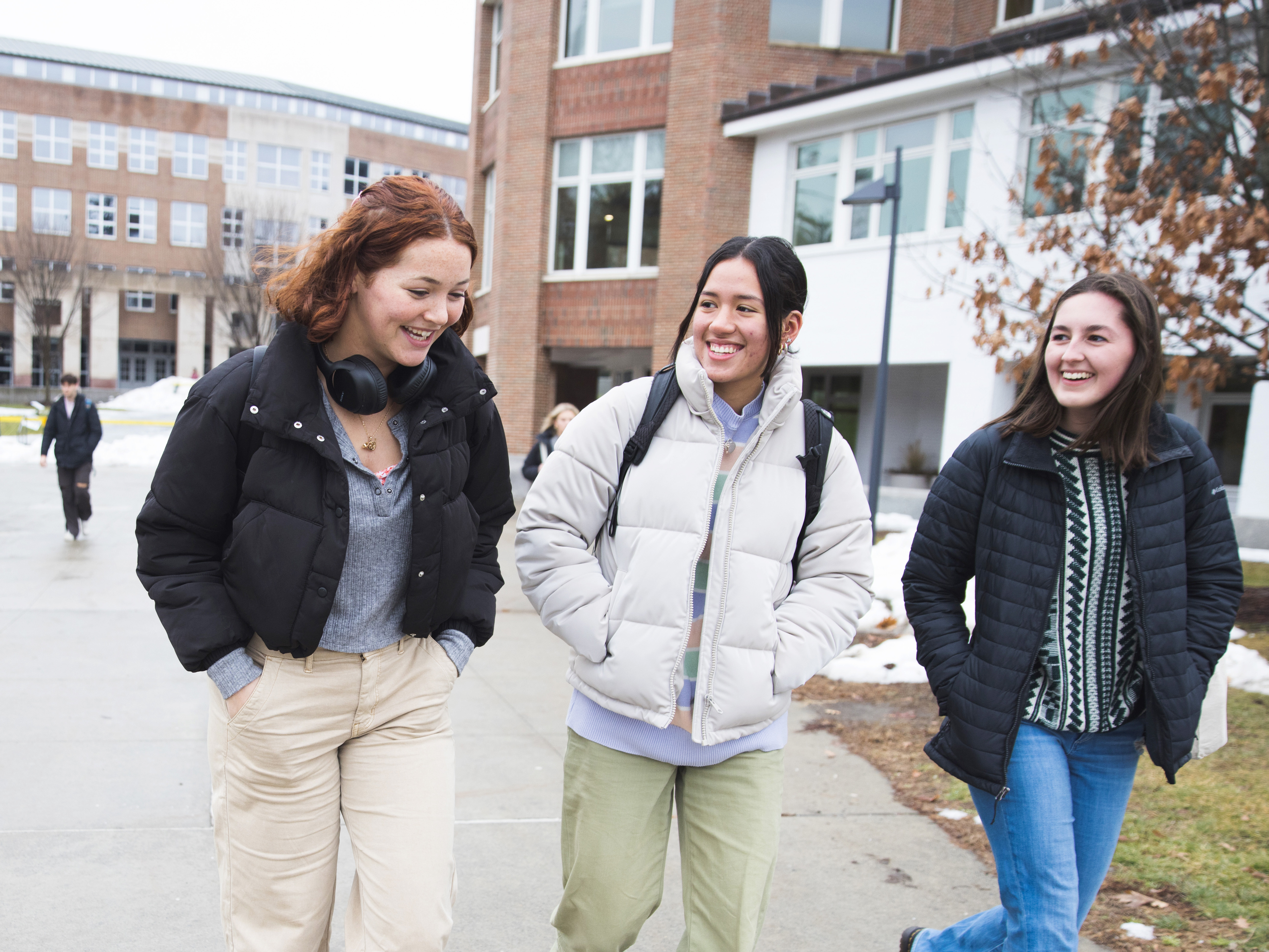 three students walking on campus