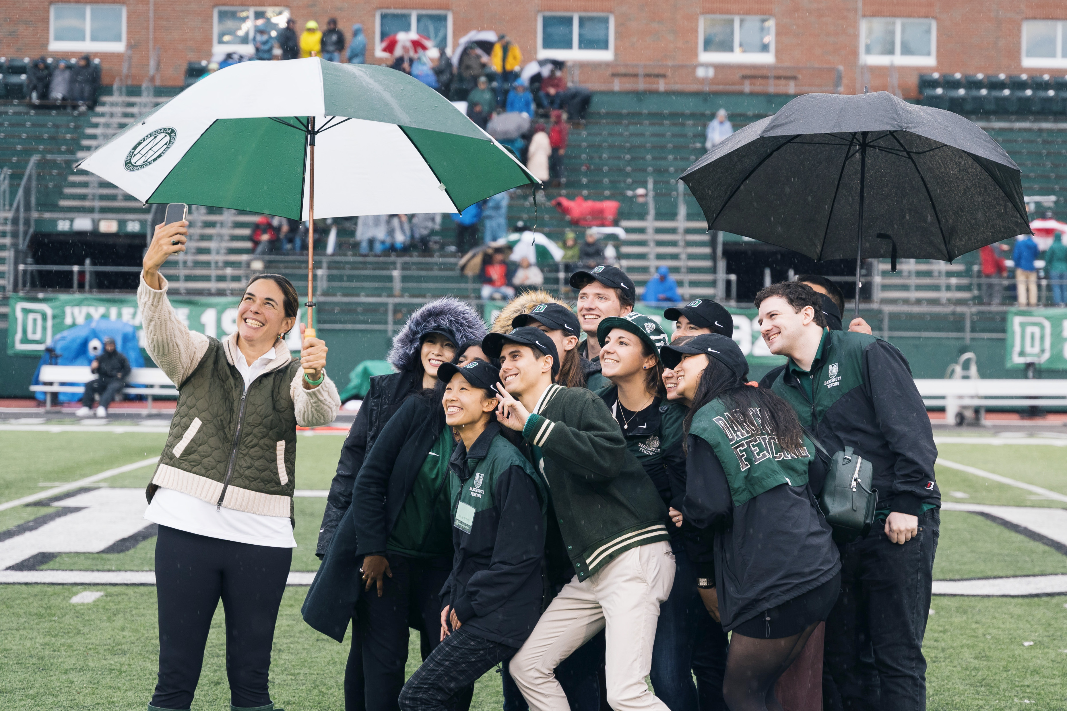 students posing for a selfie with President Beilock