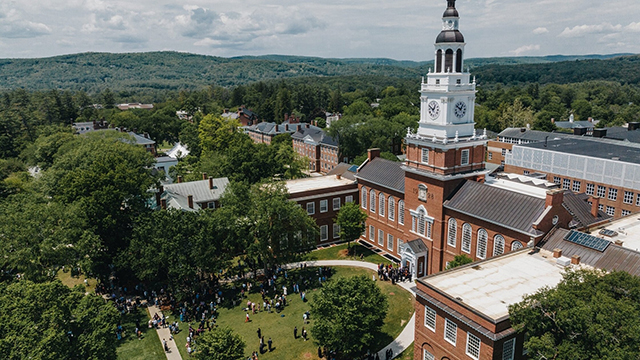 Baker tower with alumni on the lawn in front