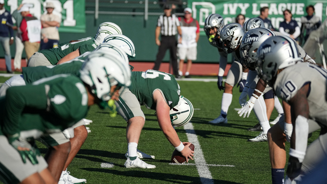 A photo of the Dartmouth football team lined up before the snap. 