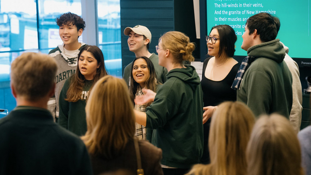 A group of Dartmouth students singing the Alma Mater.