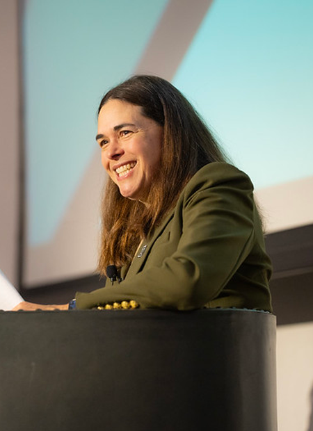 President Beilock smiling in a seat onstage