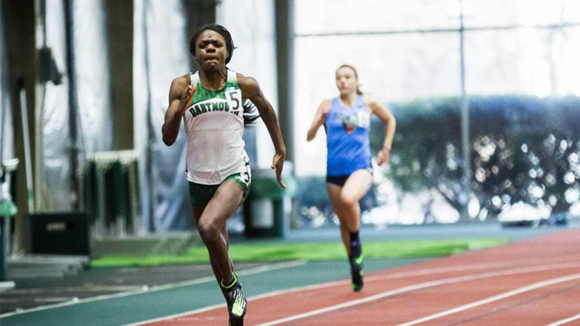 A young athlete sprinting mid-race