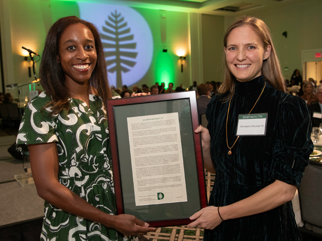 Alumni Council president posing with an honoree and their award