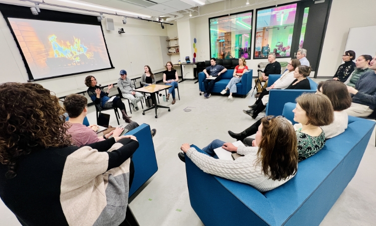 Thayer School of Engineering Dean Alexis Abramson, sitting below the screen, leads a conversation in one of the engineering school’s new spaces.