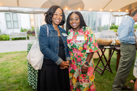 Trustee Shonda Rhimes 91 posing with a guest. 