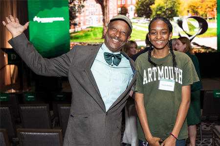 Father and daughter smiling at PWT event